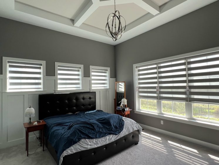 Custom window bedroom treatments by Bartlett Blinds.