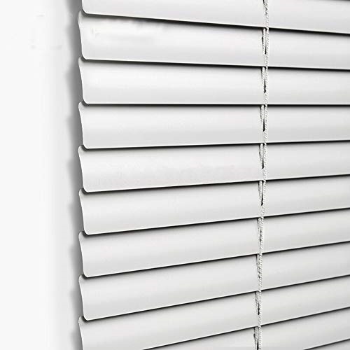 Close up of a set of aluminum mini blinds, closed on a window for display.