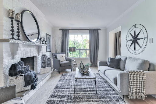 Grey-themed living room with long, custom grey drapes.